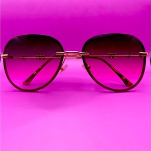 Sunglasses (Purple) with arrow & heart on the stem of the glasses.